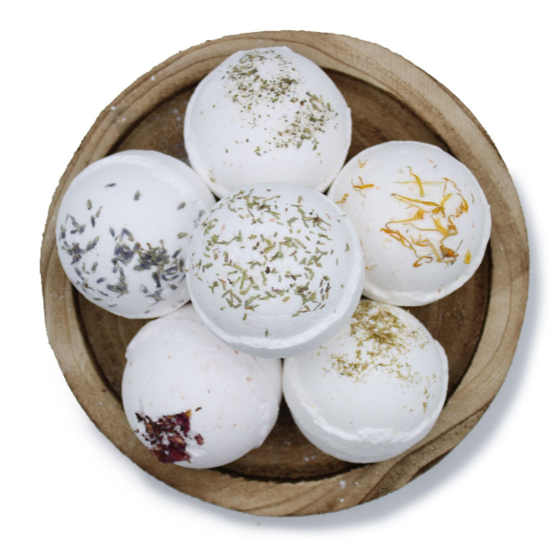 Pile of bath bombs in a wooden bowl